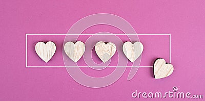 Five hearts on a Ã¼ink colored background, hand put the last heart in the row, rating, giving feedback, business evalua Stock Photo