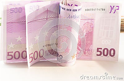 Five hundred Euro bill in wave shape with money clip Stock Photo