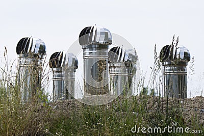 five large aluminum chimneys Stock Photo