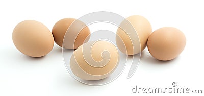 Five light brown chicken eggs. Stock Photo