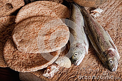 Five loaves of bread and two fish Stock Photo