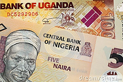 A five Nigerian Naira bank note with a thousand Ugandan shilling bill Stock Photo