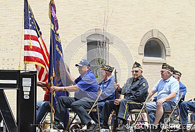 Five older men in a float in a parade in small town America Editorial Stock Photo