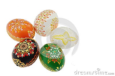 Five ornamental home made hand painted easter eggs placed in circle creating flower shape, white background. Stock Photo