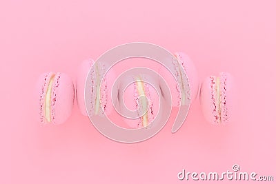 Five pink macaroons homemade, on pink background, top view Stock Photo