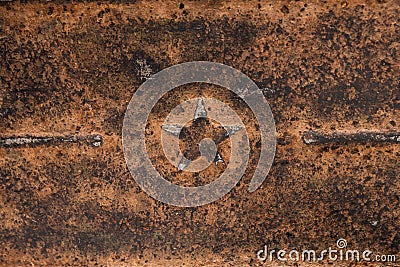 Five-pointed Soviet star on rusty metal. Rusty iron background Stock Photo