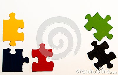 Five primary-colored hand-painted pieces of a jigsaw puzzle Stock Photo