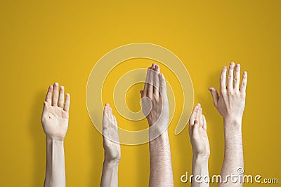 the five raised human hands isolated on the colourful background as a concept of vote and agree Stock Photo