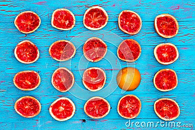 Five rows of ruby red grapefruit halves Stock Photo