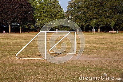 A five a side football or soccer goal post in a park or recreation area for the public to use Stock Photo
