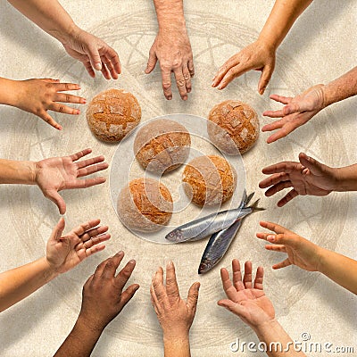 Five small barley loaves and two small fish for many Stock Photo