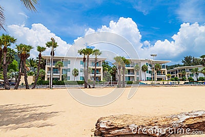 five-star hotel on the shores of Karon Beach with palm trees and yellow creaky sand Stock Photo