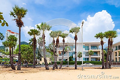 five-star hotel on the shores of Karon Beach with palm trees and yellow creaky sand Stock Photo
