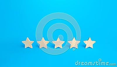 Five stars on a blue background. Rating evaluation concept. High satisfaction. Good reputation. Popularity rating of restaurants Stock Photo