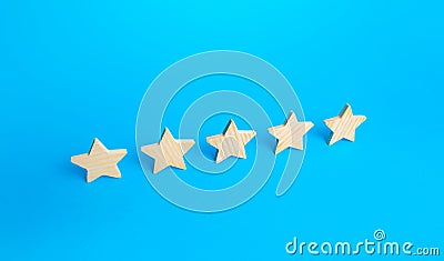 Five stars are in a row on a blue background. Rating evaluation concept. Popularity of restaurants, hotels or mobile applications Stock Photo