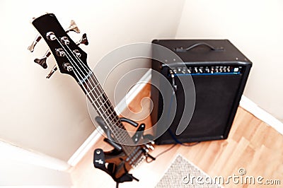 Five string bass guitar and amplifier Stock Photo