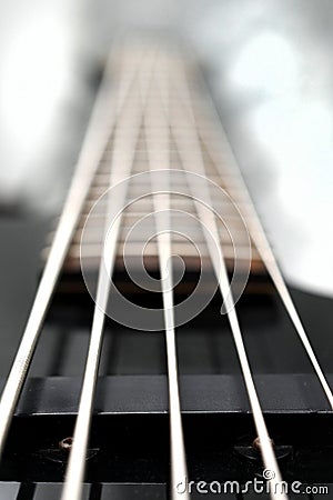 Five string bass guitar frets fretboard and strings Stock Photo