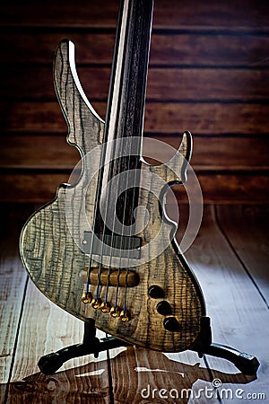 Five-string electric dark wood bass. Background for music and creativity Stock Photo