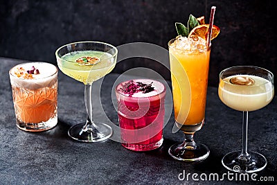 Five variously colored cocktails teasing the drinker Stock Photo