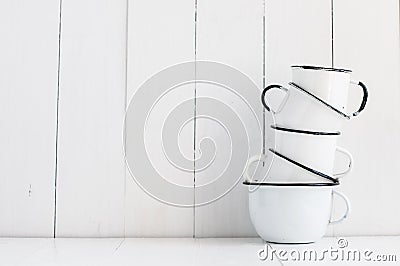 Five white enameled mugs Stock Photo
