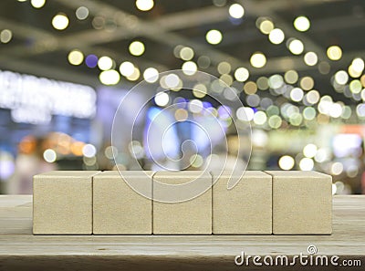 Five wood block cubes on wooden table Stock Photo