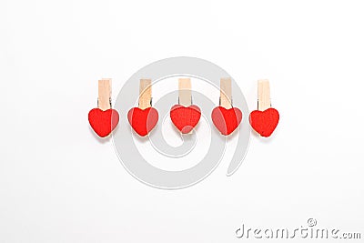 Five wooden pins with heart shaped Stock Photo