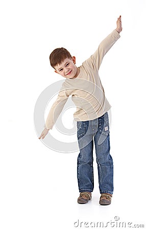 Five year old imitating flying smiling Stock Photo