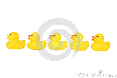 Five yellow plastic rubber duck in a row Stock Photo