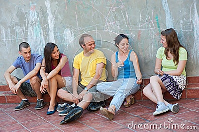 Five young people talking Stock Photo