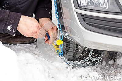 Fix snow chains on car Stock Photo