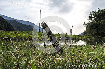 Fixed knife on grass. mountains behind blurred. Military. Outdoor. Azerbaijan Caucasus Stock Photo