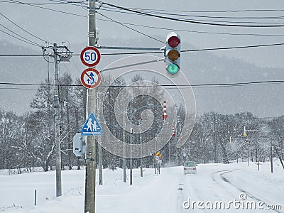 Fixed-post delineators or fletchings used on a road in Hokkaido, Japan Editorial Stock Photo