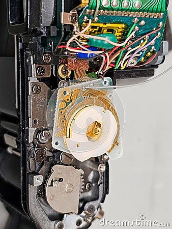 Fixing a camera. Exposed insides of an slr camera. Broken part. Electronics. Mechanics. Stock Photo