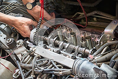 Fixing car engine using local method in Thailand Stock Photo