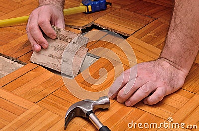 Fixing Damaged Floor Stock Photo