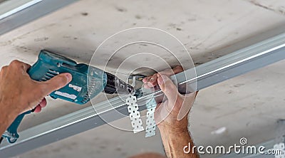 Fixing plasterboard sheets. Stock Photo