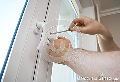 Fixing window handle. Stock Photo