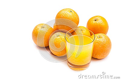 Fizzy orange juice from effervescent tablet with oranges at backdrop, flushed right Stock Photo