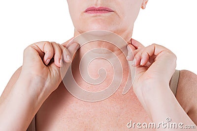 Flabby skin on the neck of an elderly woman isolated on white background Stock Photo