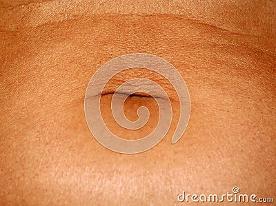 Flabby wrinkled abdomen. The navel is stretched. Stock Photo