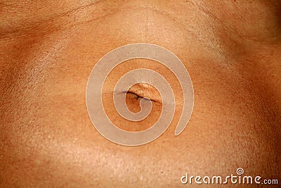 Flabby wrinkled abdomen. The navel is stretched. Stock Photo