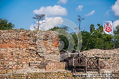 Flag above ruins of Wenecja castle in Poland Editorial Stock Photo