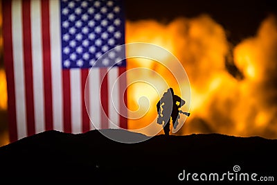 Flag on burning dark background. Concept of crisis of war and political conflicts between nations. Selective focus Stock Photo