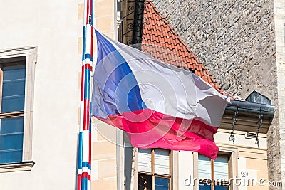 Flag of the Czech Republic. Two equal horizontal bands of white top and red with a blue isosceles triangle based on the hoist Stock Photo