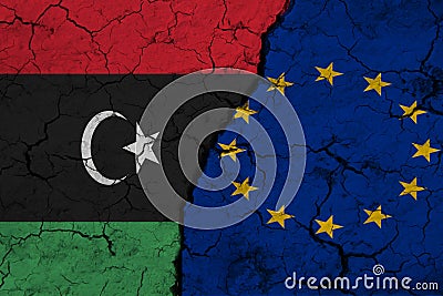 Flag of Libya and EU on Textured Cracked Earth. The concept of cooperation between the two countries Stock Photo