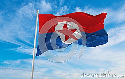 flag of National Liberation Front of Southern Korea , South Korea at cloudy sky background on sunset, panoramic view. Korean Cartoon Illustration