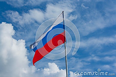 Flag of Russia against the blue sky Stock Photo