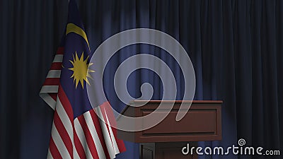 National flag of Malaysia and speaker podium tribune. Political event or statement related conceptual 3D rendering Stock Photo