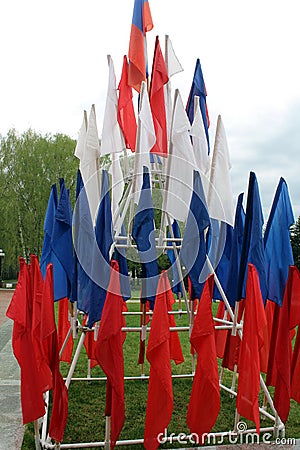 Small flags stand on a steel frame in the form of a triangle, symbolizing the Yarussian flag Stock Photo