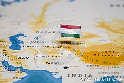 The Flag of Tajikistan in the World Map Stock Photo